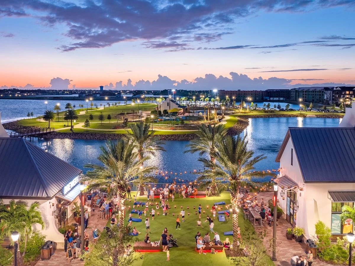 Waterside Place waterfront and palms at dusk